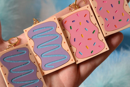 Both colors of PopTarts against blue background