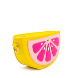 Purse is shown against a white background. Purse is a half of a grapefruit. Purse is yellow with a light pink center, and dark pink accents. Purse is shown at an angle
