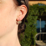 Model wearing earrings outside