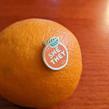 Pin stuck in an orange