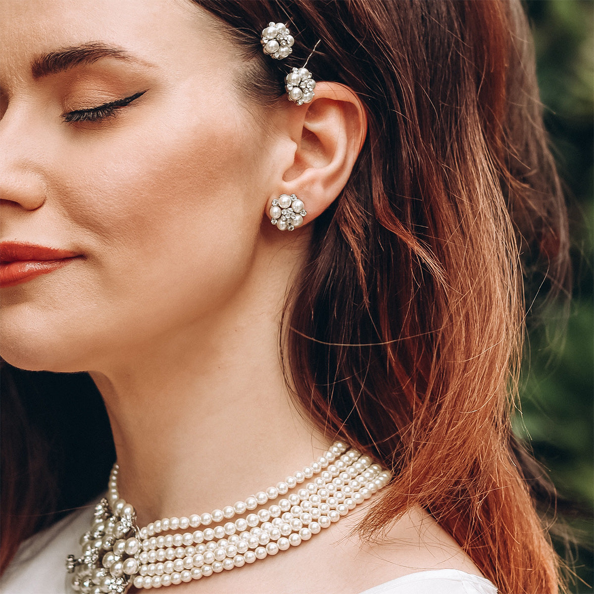 Model wearing earrrings and necklace