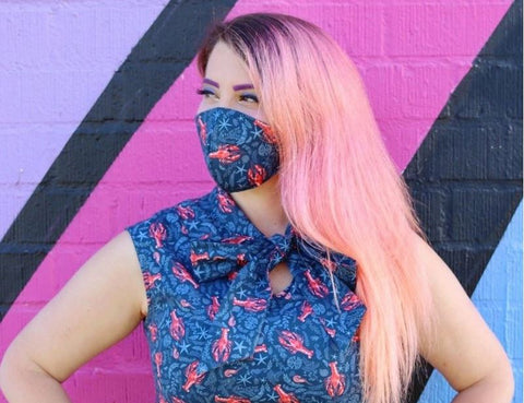 Female model wearing the face mask against a colorful background