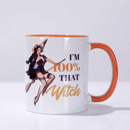 Witch pinup on broom. Orange and black lettering stating "I'm 100% that witch".