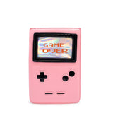 Photo shows the purse from an angle. Purse is a light pink with game-boy like features.