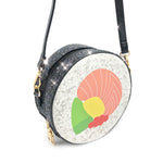 Purse is shown against a white background, with sparkle accents to showcase that this purse has glitter edges. Purse is a black circle with the sushi center. 