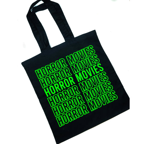 This photo shows the bag against a white background. Bag is black with neon green lettering that says "horror movies" multiple times in a vertical line