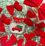 Brooch surrounded by red bows